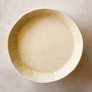 A bowl of lemon glaze.