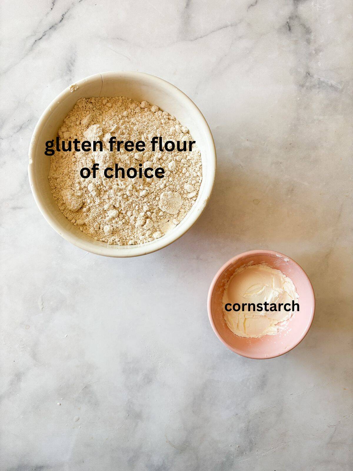 This easy homemade gluten free cake flour is perfect in cakes and more. Gluten-free flour and cornstarch feature in this DIY blend. Ingredients for gluten free cake flour are text-labeled.