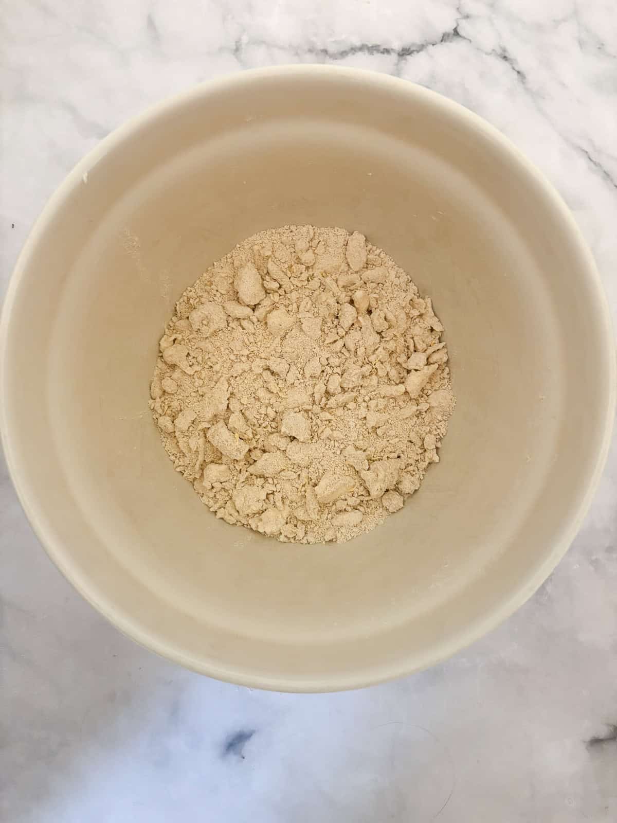 These tender and fluffy gluten free berry buckwheat scones are made with buckwheat and almond flours, yogurt, and fresh or frozen berries. Adding butter to dry ingredients for buckwheat scones.