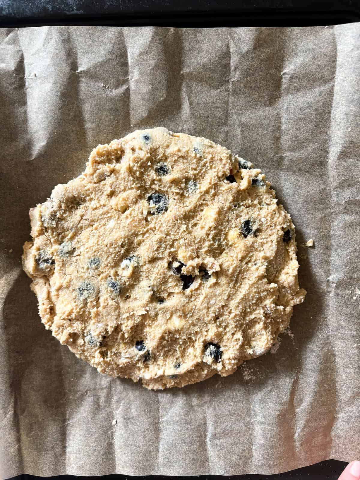 These tender and fluffy gluten free berry buckwheat scones are made with buckwheat and almond flours, yogurt, and fresh or frozen berries. Buckwheat scones batter patted out into a circle.