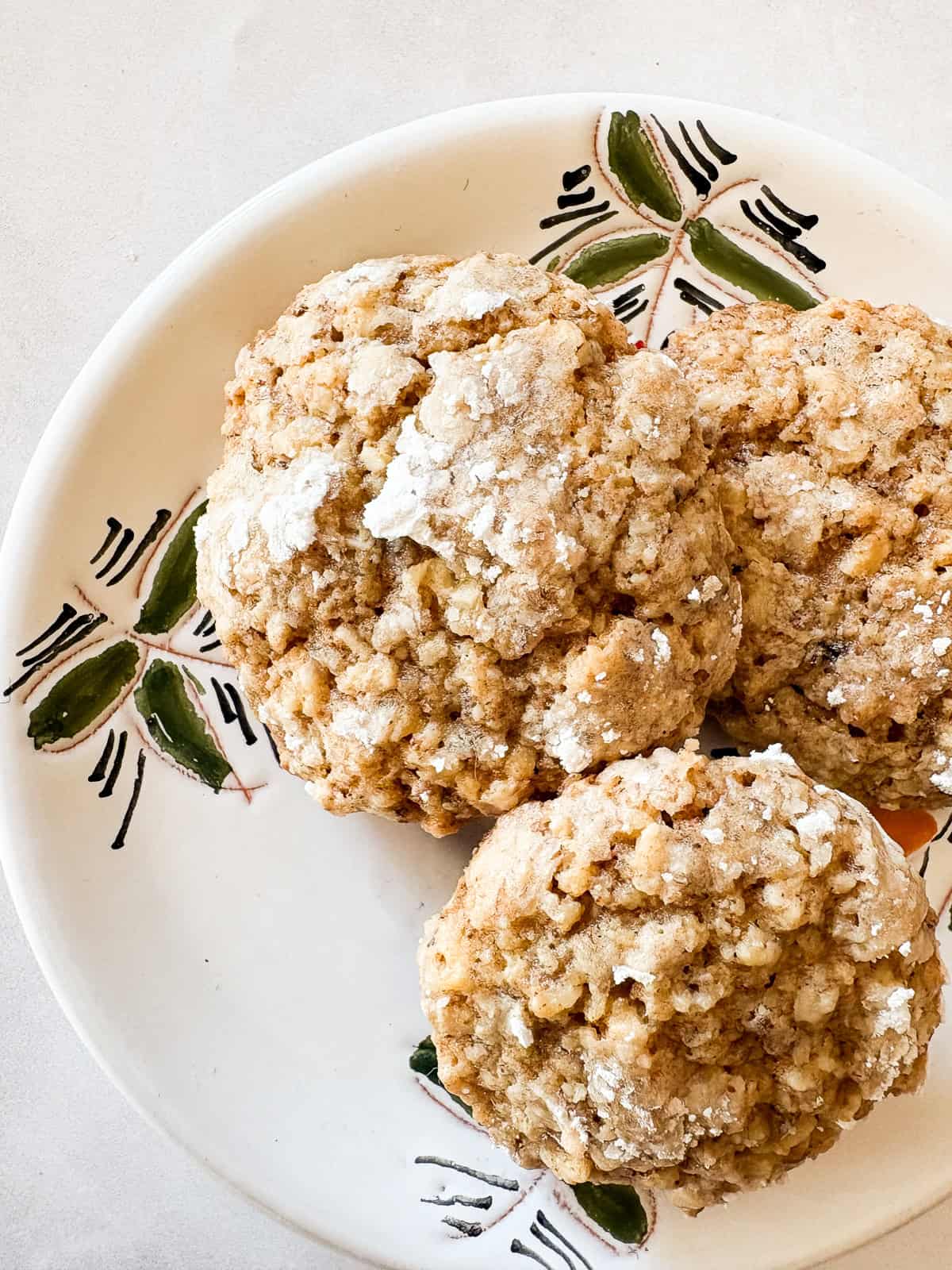 Chewy Moroccan ghriba cookies with walnuts and cinnamon are lightly sweet, rolled in powdered sugar, and easily gluten-free. Crackly topped ghriba cookies on a plate.