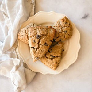 Gluten free chocolate chip scones on a plate with a napkin.