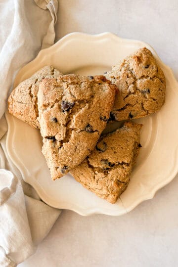 Gluten free chocolate chip scones on a plate with a napkin.