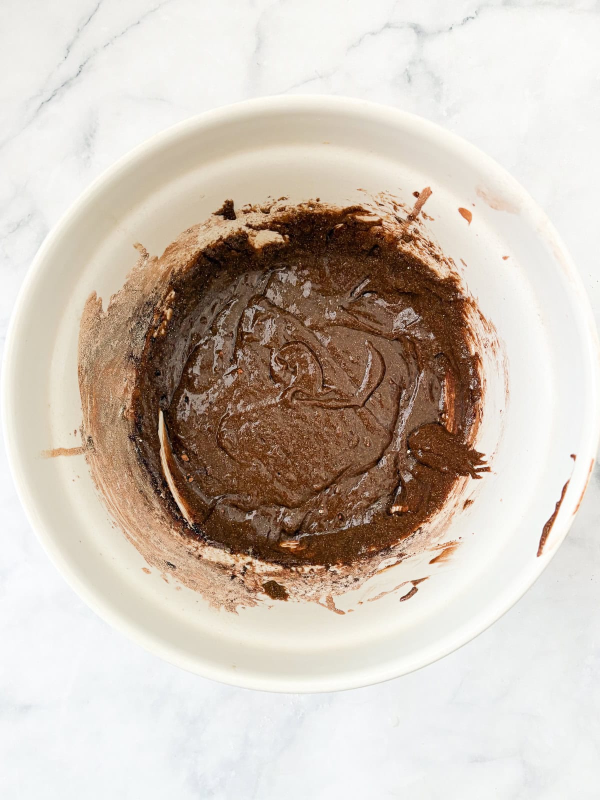 Moist and gloriously chocolatey gluten free chocolate zucchini bread is made with olive oil, plenty of chocolate, and, of course, zucchini! More ingredients are added to the batter of chocolate zucchini bread.