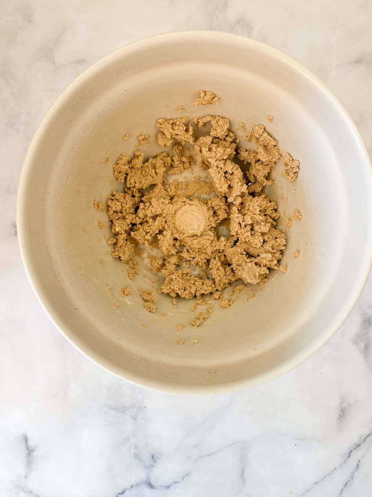 Melt-in-your-mouth gluten free lavender shortbread cookies are made with plenty of butter and infused with a bit of fresh or dried lavender. Gluten free lavender shortbread cookies dough in a bowl.