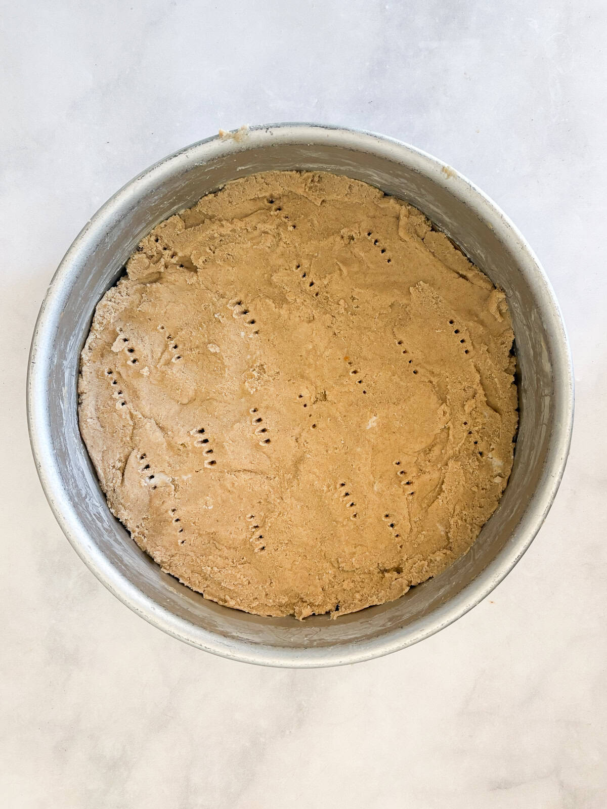 Melt-in-your-mouth gluten free lavender shortbread cookies are made with plenty of butter and infused with a bit of fresh or dried lavender. Short bread dough is pressed into a pan.