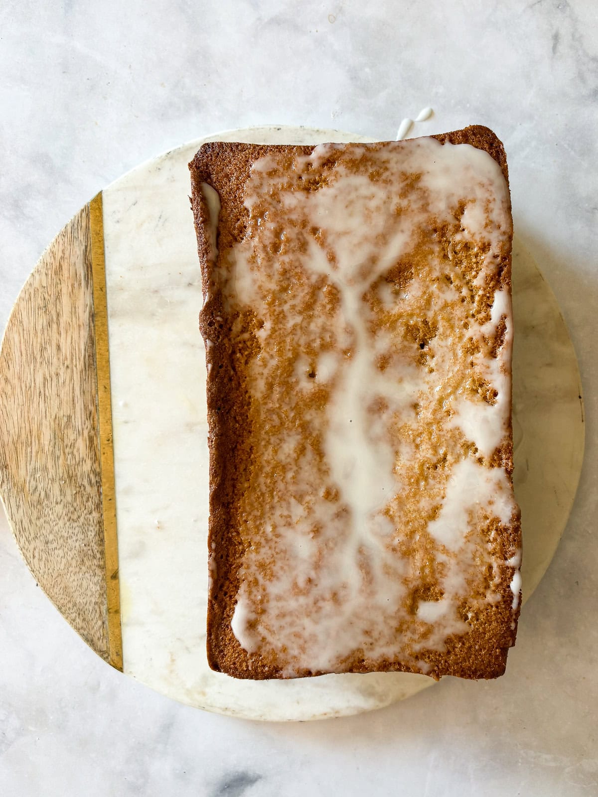 This rich and velvety gluten free lemon pound cake stays moist and tender for days! Made with oat and almond flour, cream cheese, and butter! A gluten free lemon pound cake topped with lemon glaze.