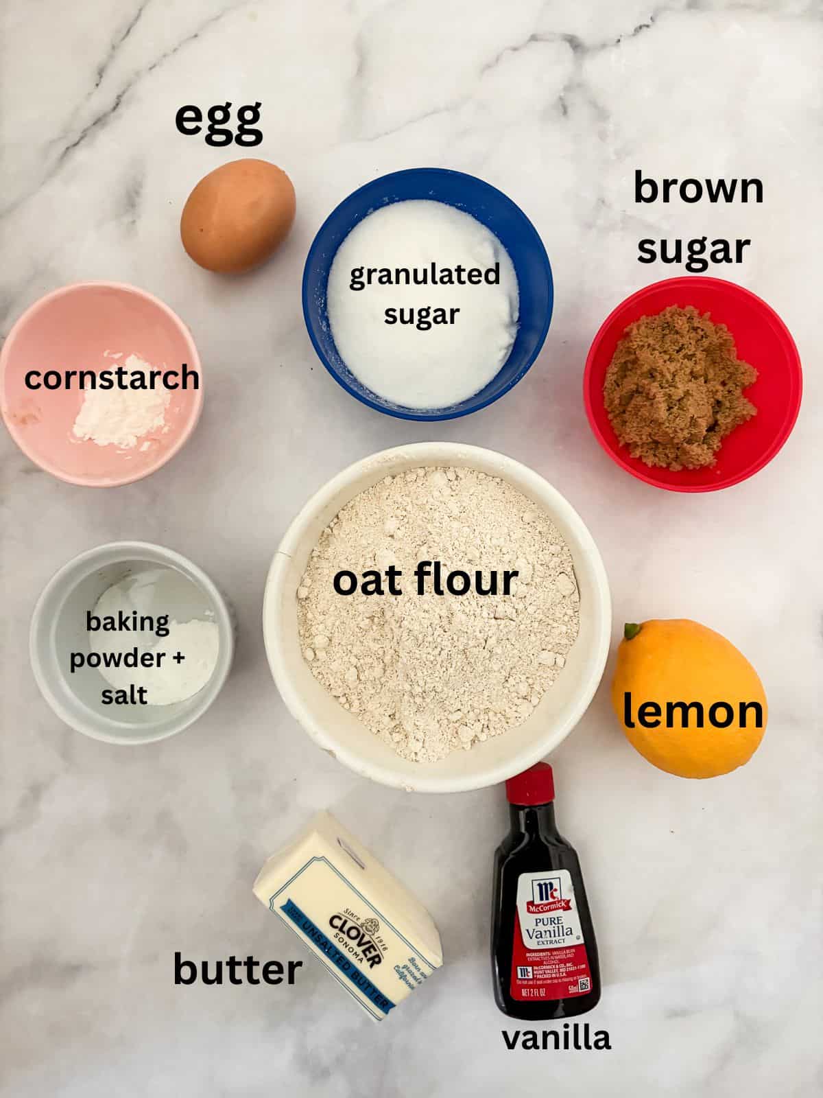 These soft and chewy gluten free lemon cookies are super flavorful thanks to bright lemon zest. Just one gluten-free flour is needed! The ingredients for gluten free lemon cookies are text-labeled.