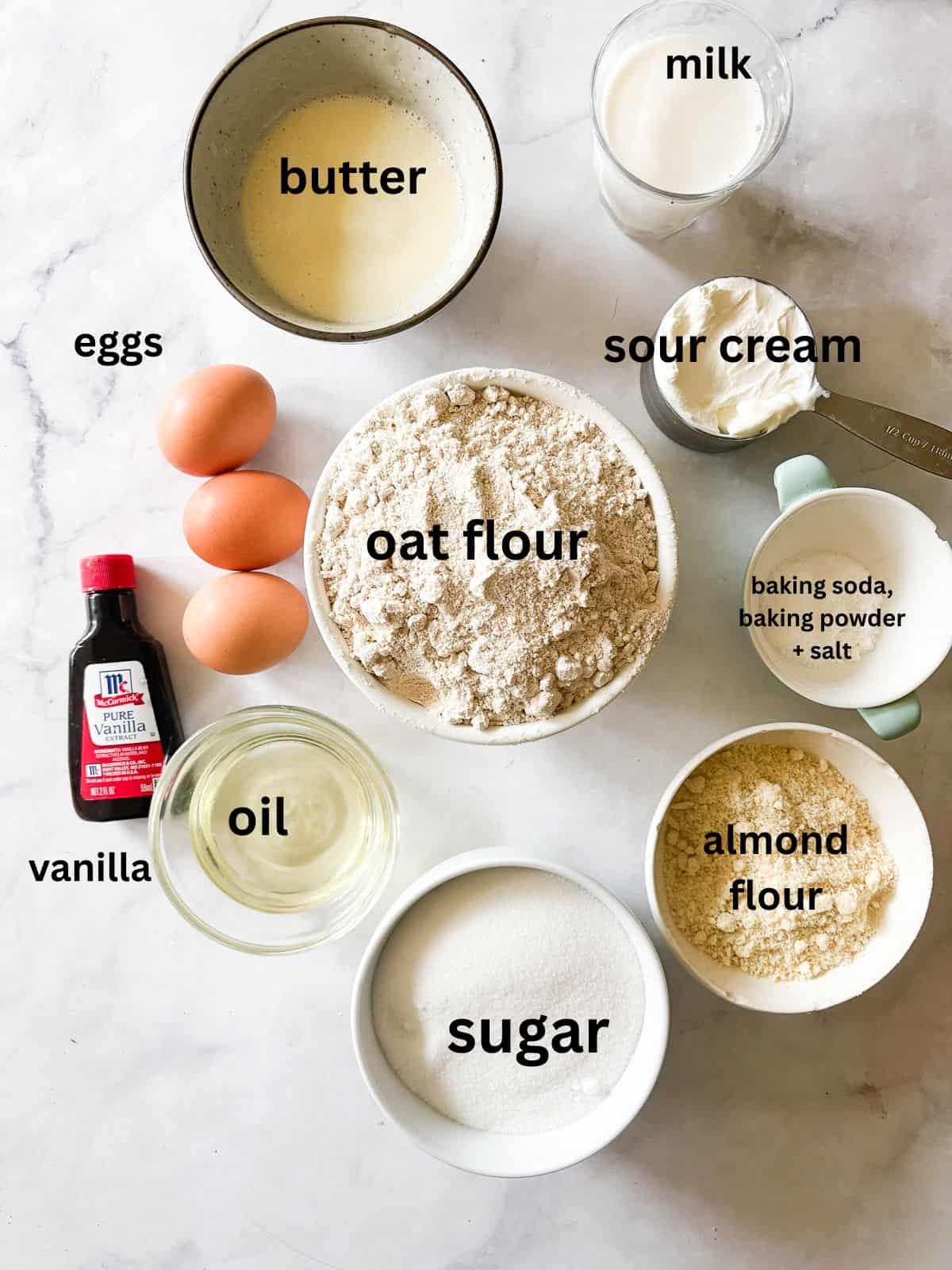 Whip up this one-bowl gluten free snack cake and enjoy with a cup of coffee, or have it waiting on the counter for when the kids come home. Ingredients for a gluten free snack cake are text-labeled.