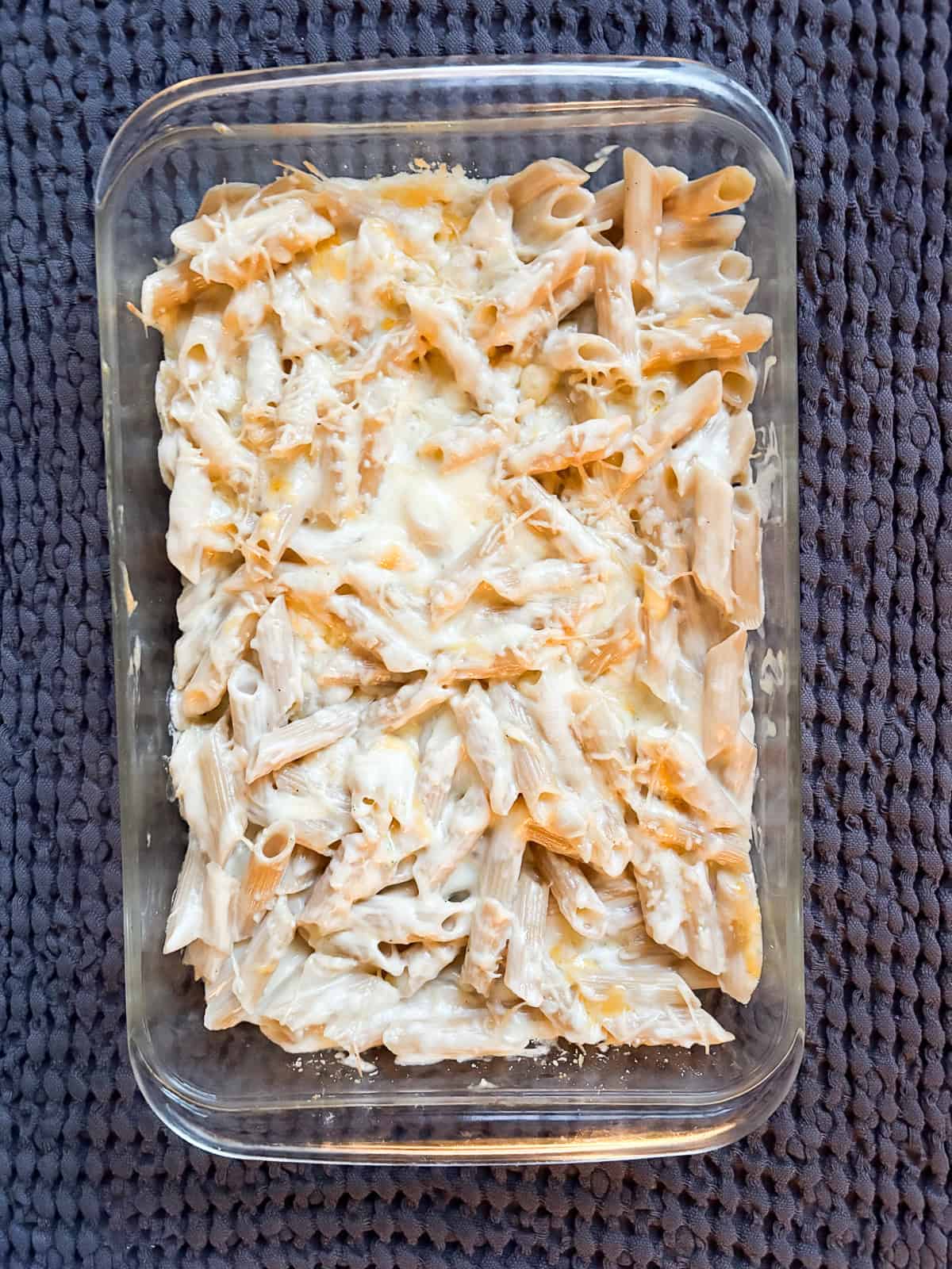 This creamy gluten free baked mac and cheese is just as good as the classic, and it's lightened up a bit but still feels indulgent. A pan of gluten free baked mac and cheese.