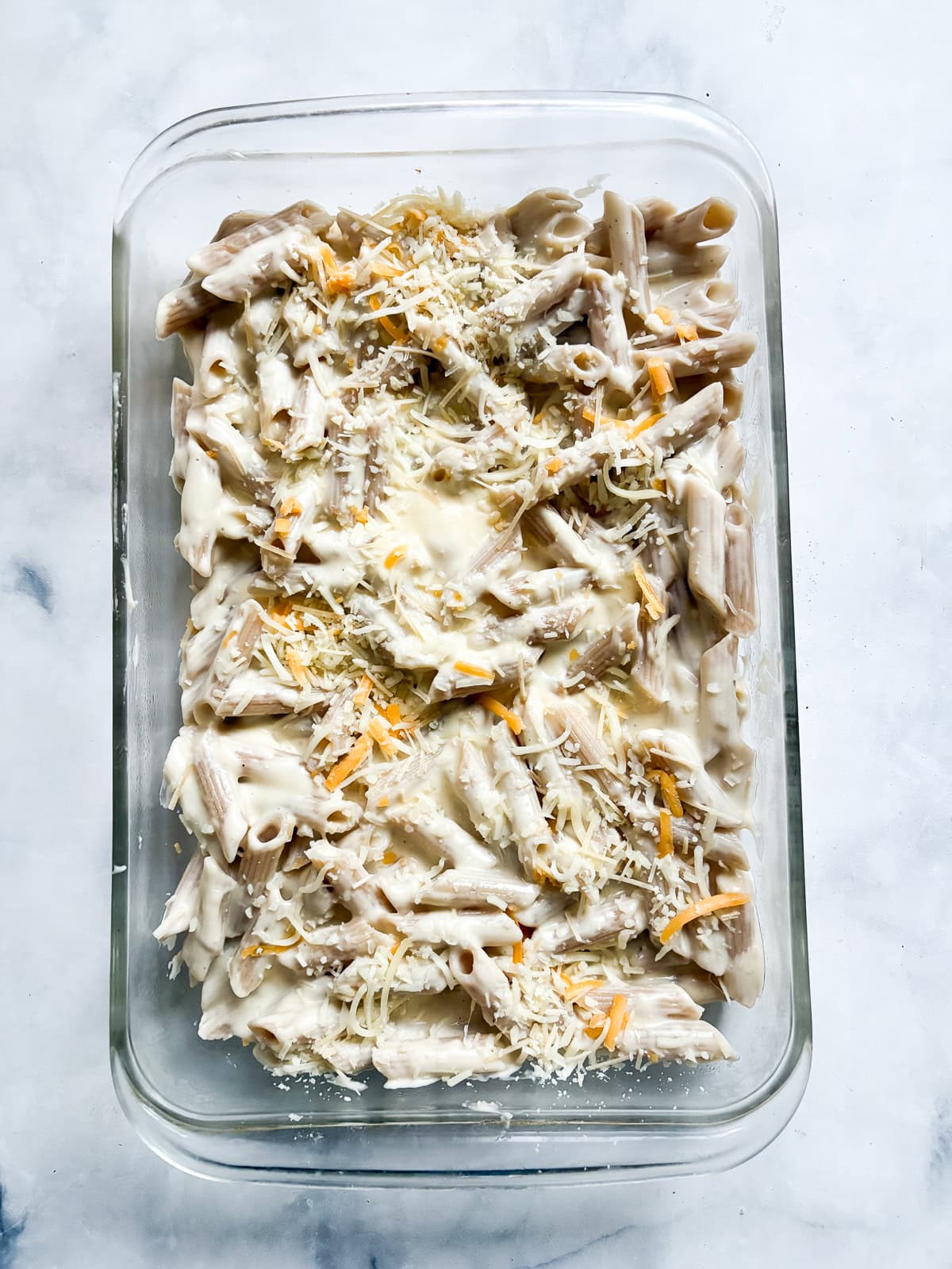 This creamy gluten free baked mac and cheese is just as good as the classic, and it's lightened up a bit but still feels indulgent. Sauce and cheese are mixed with gluten-free penne for gluten free baked mac and cheese.