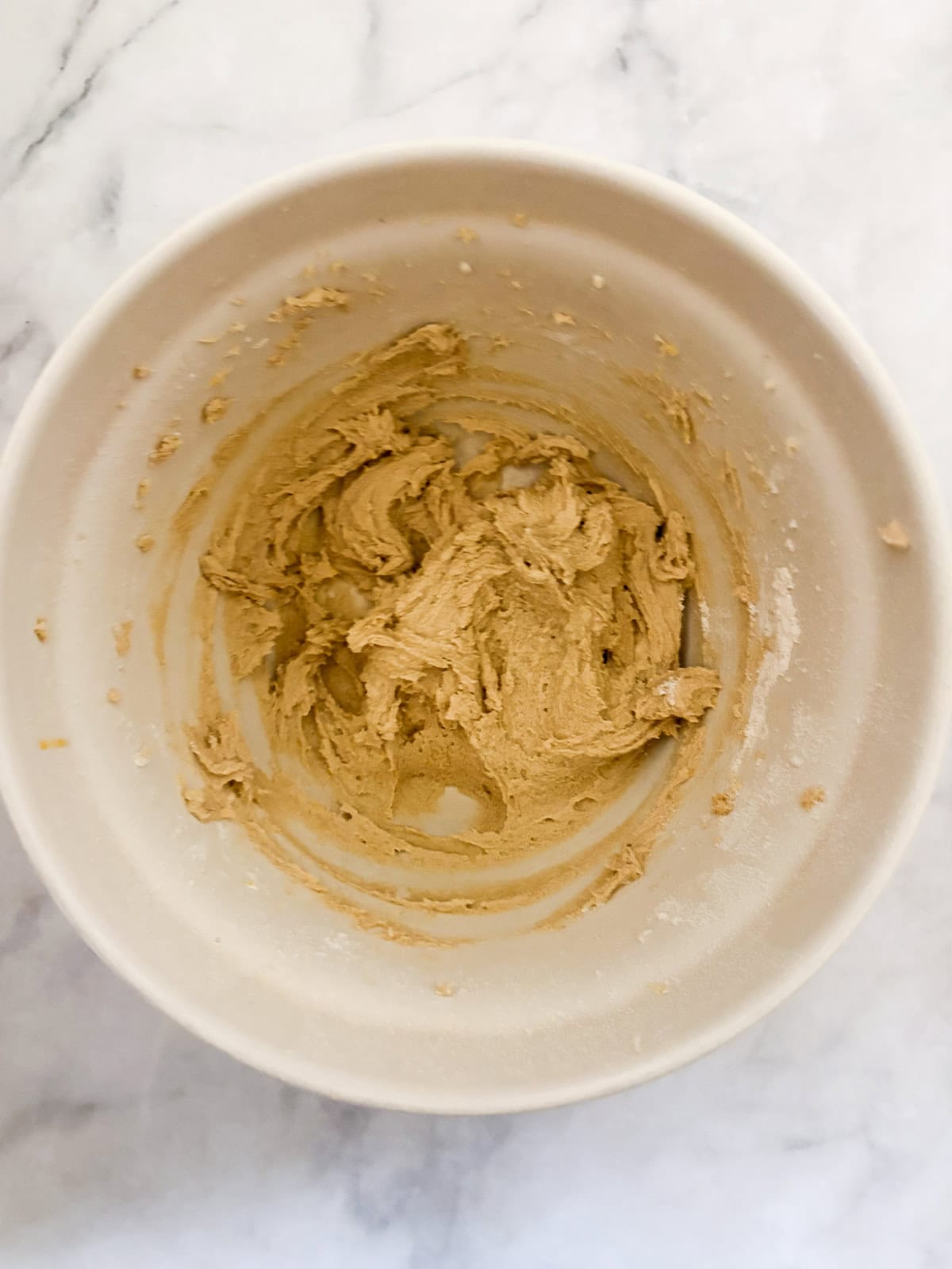 These soft and chewy gluten free lemon cookies are super flavorful thanks to bright lemon zest. Just one gluten-free flour is needed! The dough for gluten free lemon cookies in a bowl.