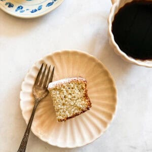 A piece of gluten free snack cake on a plate with a forl.