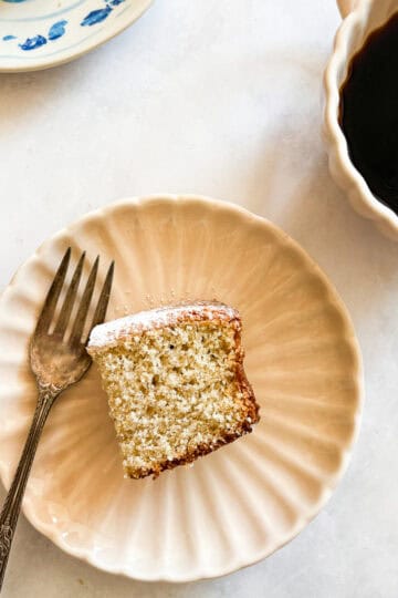 A piece of gluten free snack cake on a plate with a forl.