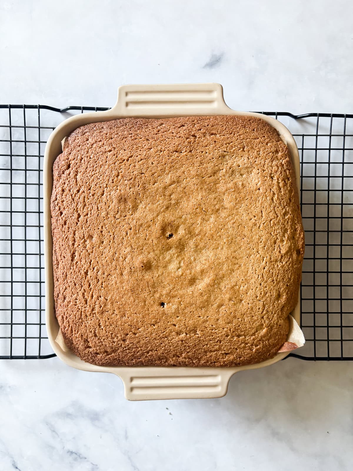 Whip up this one-bowl gluten free snack cake and enjoy with a cup of coffee, or have it waiting on the counter for when the kids come home. A gluten free snack cools in the pan.