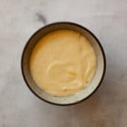 A bowl of gluten free cheese sauce.