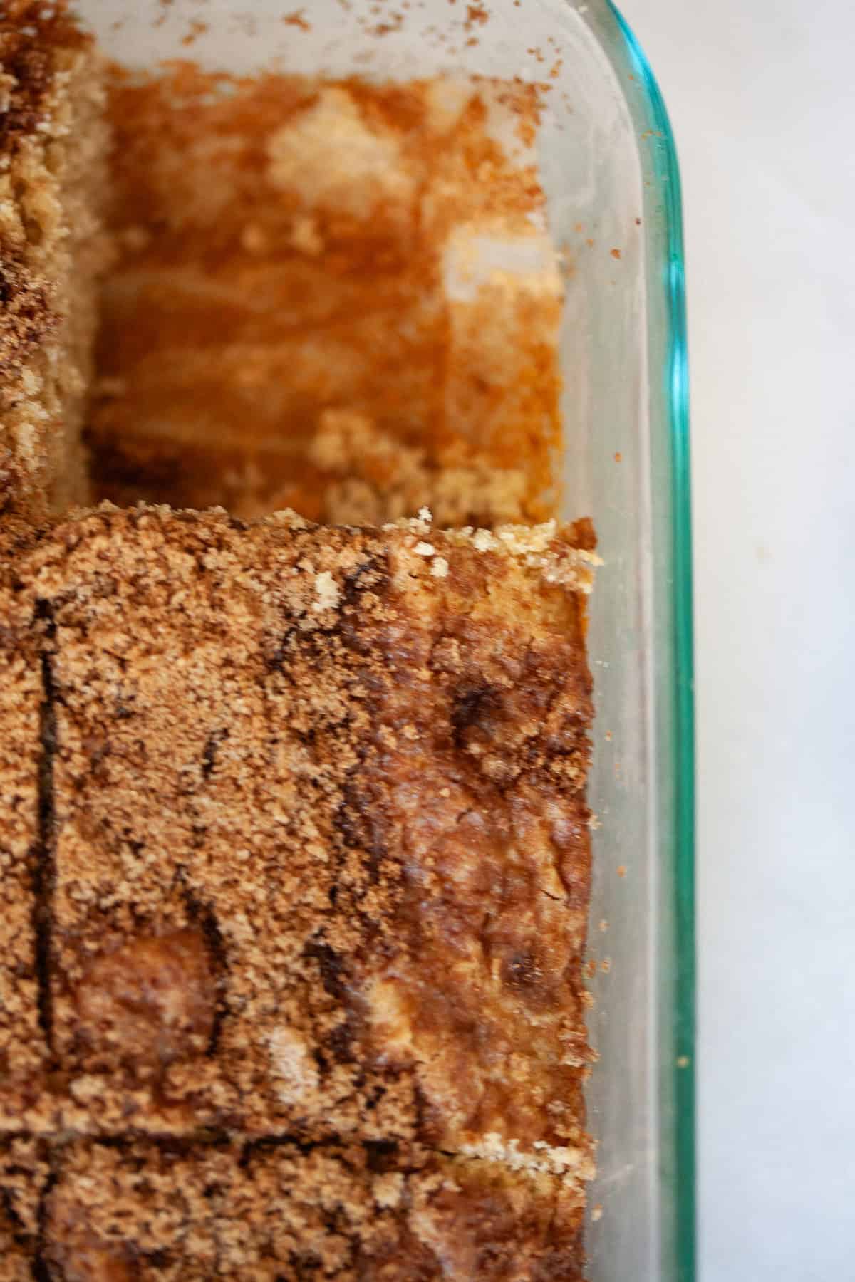 This super easy gluten free cinnamon and sugar cake is perfect for a last-minute dessert or quick breakfast coffee cake option! A pan of gluten free cinnamon and sugar cake.