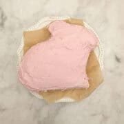 Pink frosting tops a gluten free Easter bunny cake.