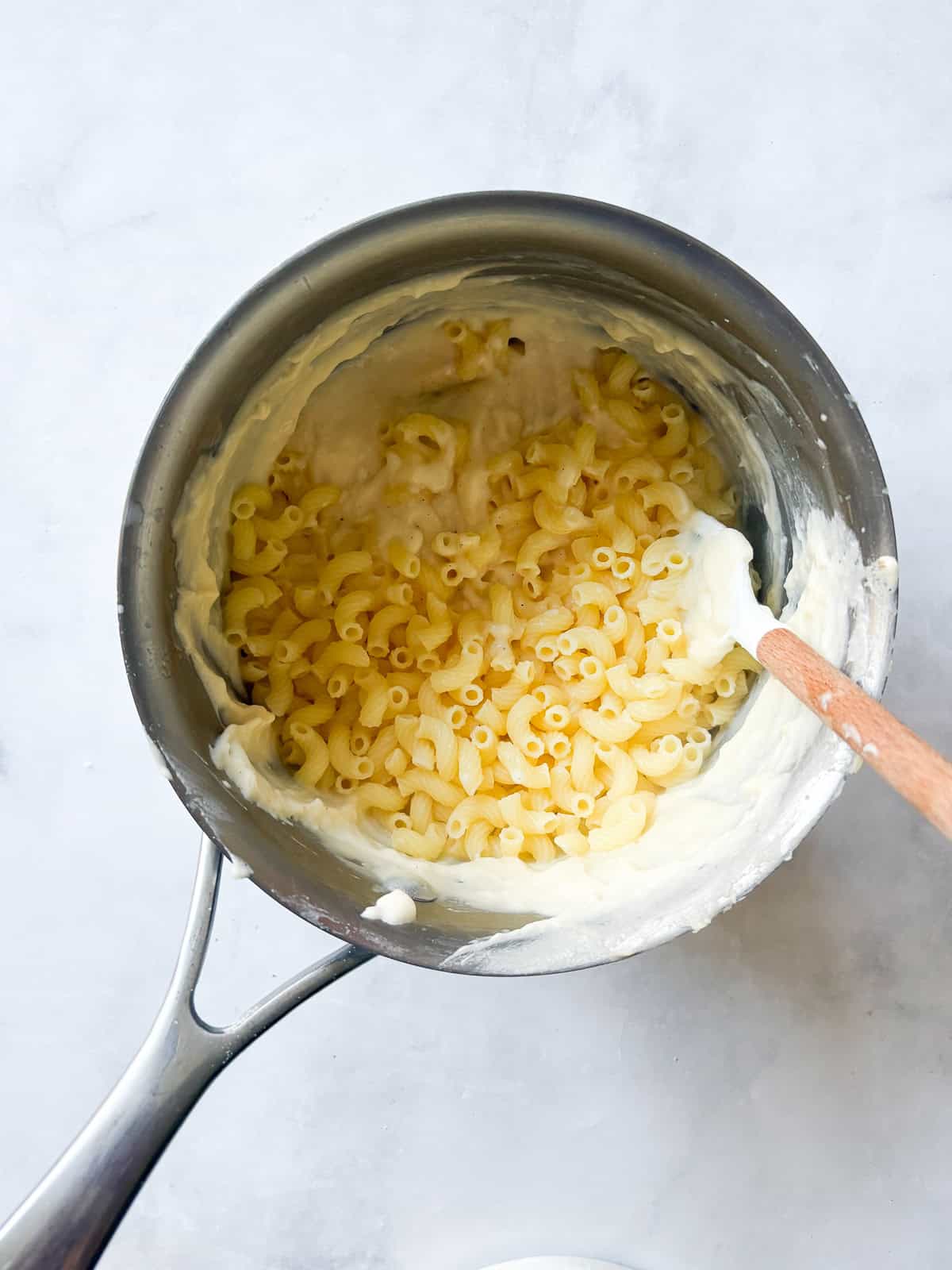Every bite of this creamy, one pot gluten free mac and cheese delivers homemade comfort - so much better than store-bought! Fast and easy. Pasta is added to a pot of cheese sauce.