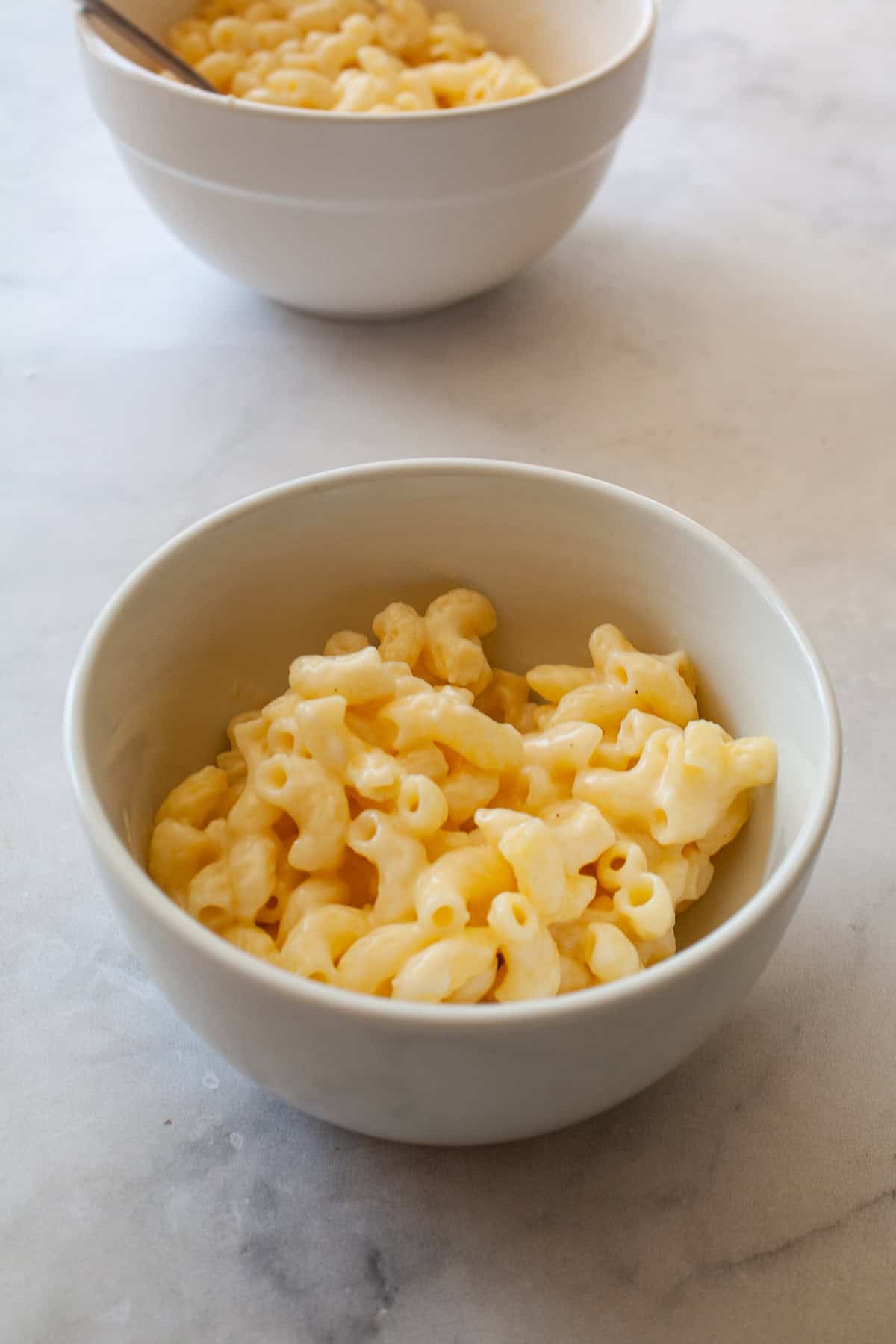 A white bowl of one pot gluten free mac and cheese.