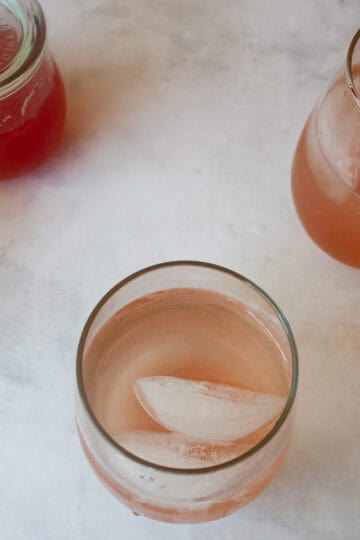 A rhubarb gin and tonic with ice.