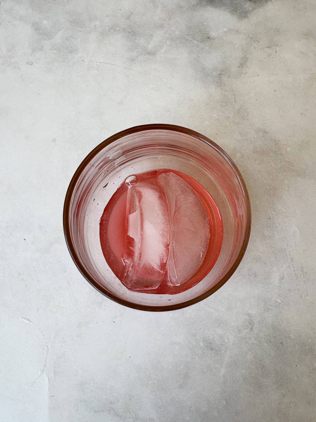 For a gorgeous twist on a classic, stir homemade rhubarb syrup into good gin and bubbly tonic water for a refreshing cocktail. Add rhubarb syrup to a glass with ice.