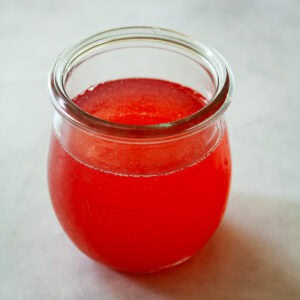 A jar of rhubarb simple syrup.
