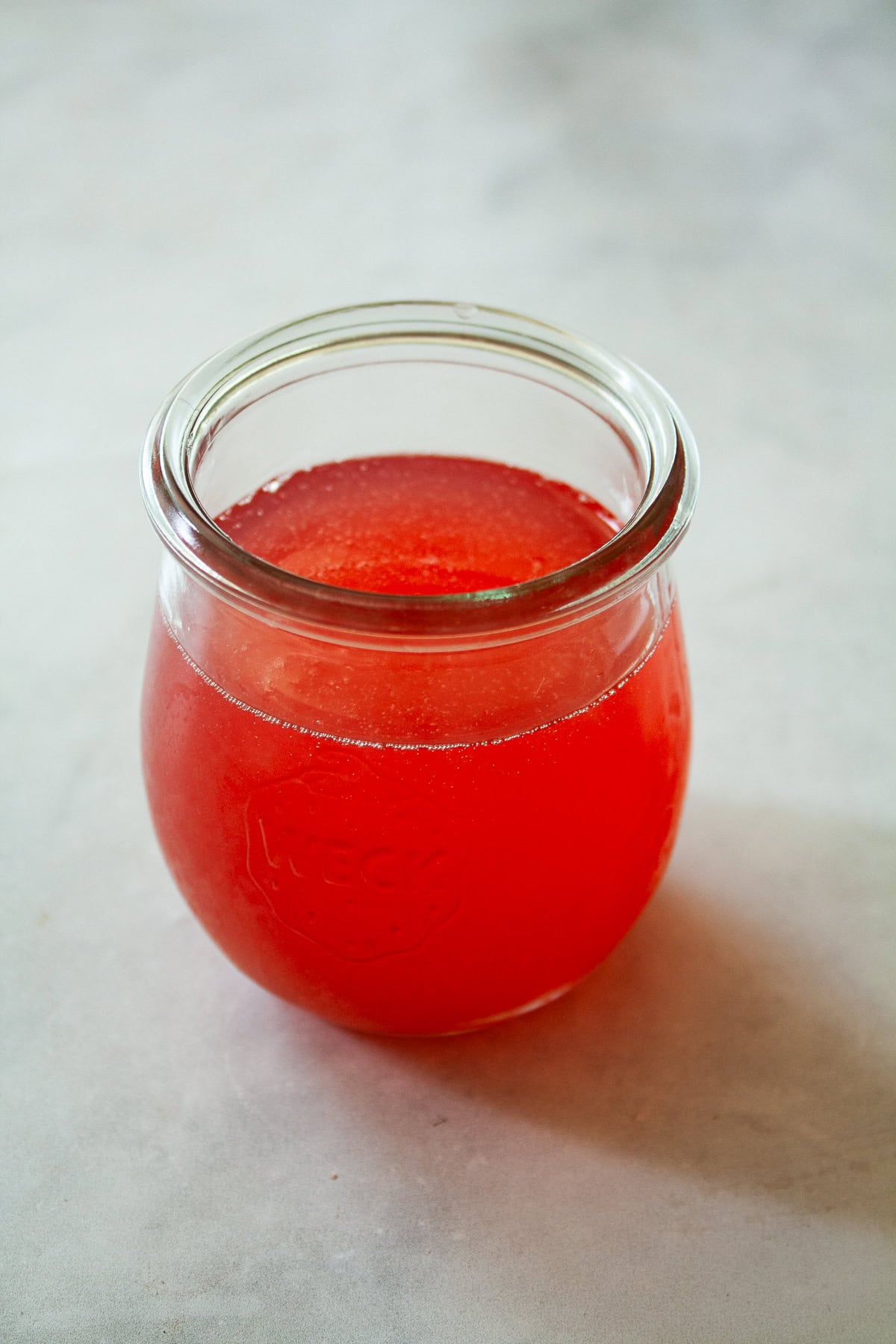 A jar of rhubarb simple syrup.