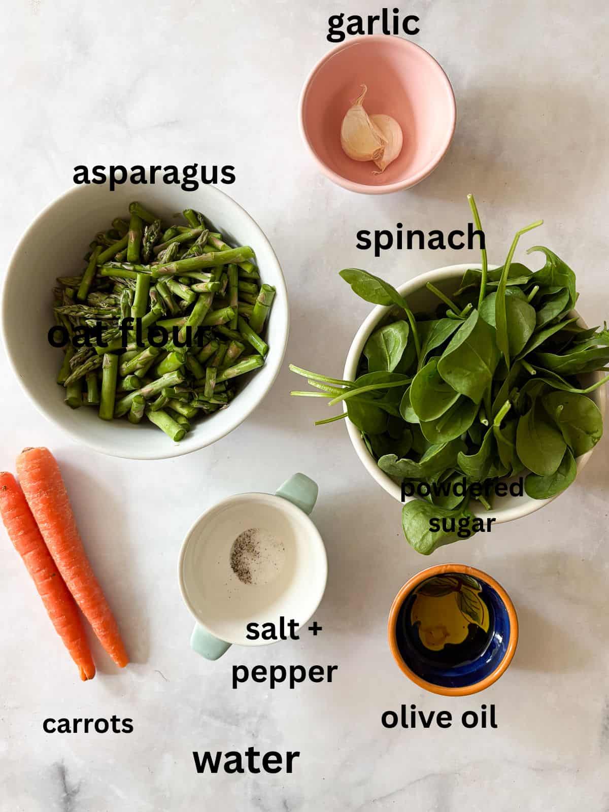 Creamy, vegan asparagus and spinach soup is made with minimal ingredients to create a velvety, nourishing soup that's always welcome. Ingredients for asparagus and spinach soup are text-labeled.
