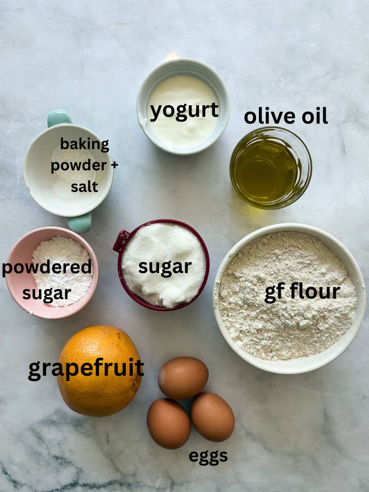 A tender and moist yogurt-based crumb makes this pretty gluten free olive oil grapefruit cake stand out. Finished with grapefruit glaze! Ingredients for gluten-free grapefruit bread are text-labeled.