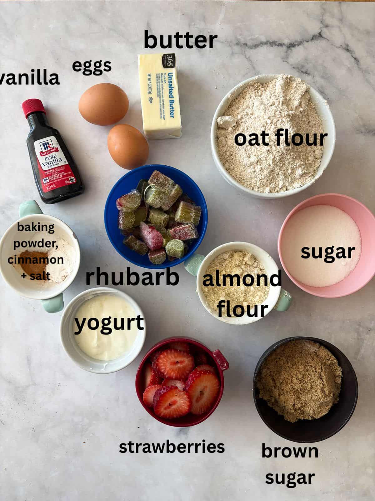 A soft, buttery gluten-free strawberry rhubarb cake packed with fresh fruit. Fork-tender, easy to make, and perfect for summer dessert. Ingredients for strawberry rhubarb cake are text-labeled.
