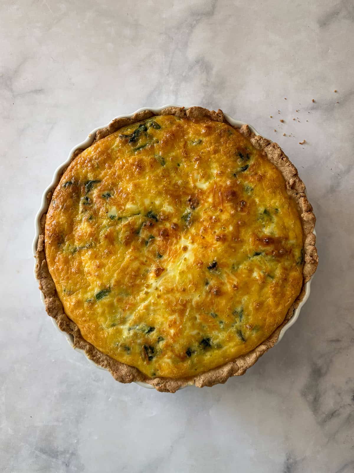 This gluten free asparagus quiche is packed with springy asparagus and salty parmesan cheese to make a wonderful brunch or dinner dish! The baked gluten free asparagus quiche.