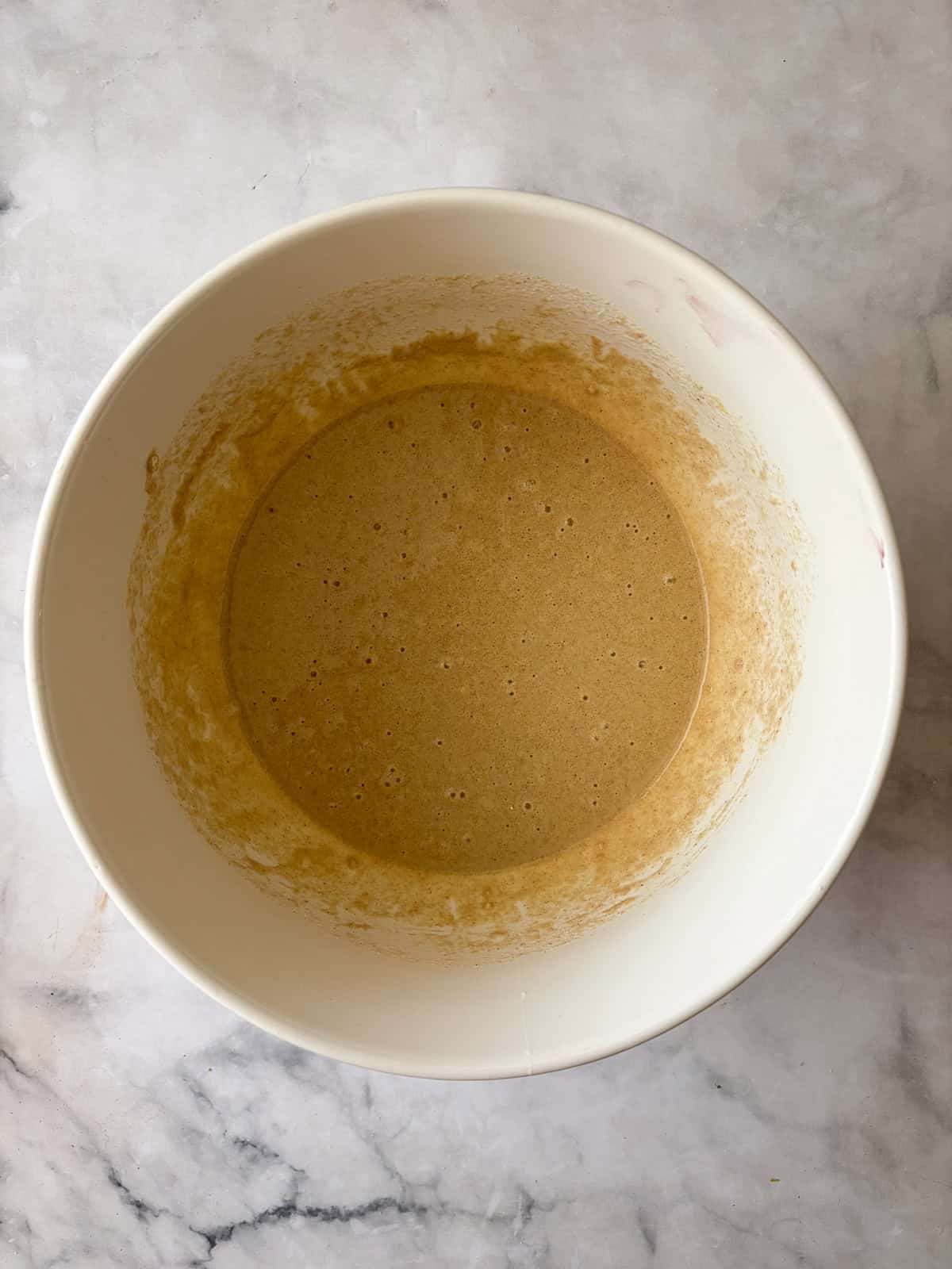Batter for gluten free berry cake in a bowl.