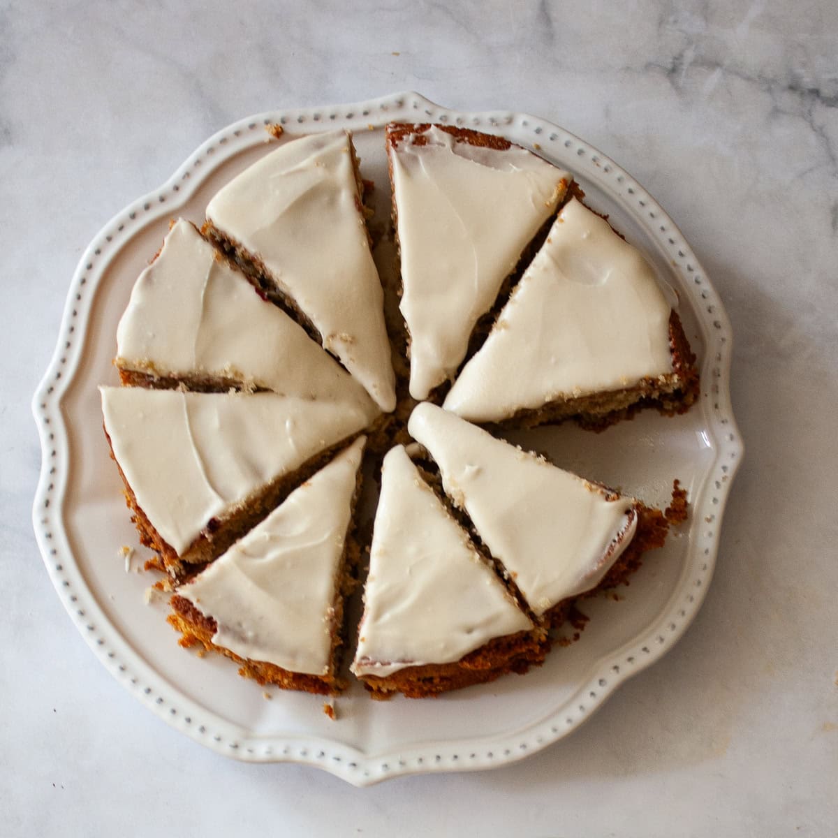 A sliced gluten free berry cake on a plate.
