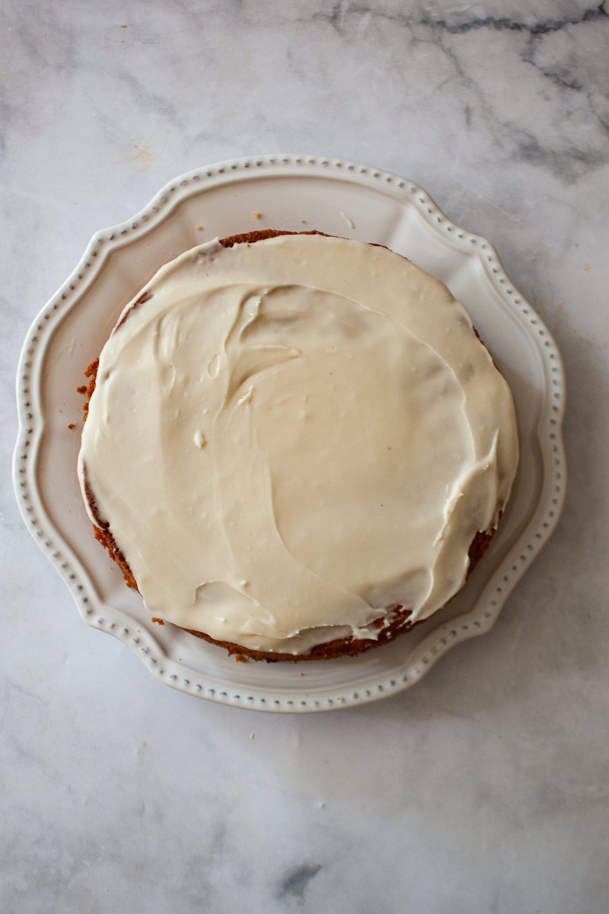 Maple glaze tops a gluten free berry cake.