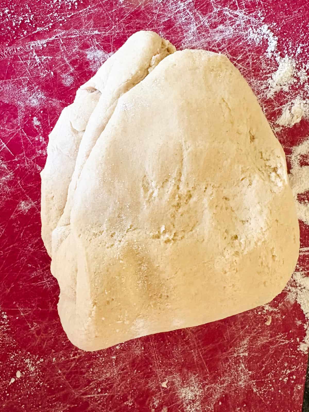 A gum-free recipe for a beautifully soft loaf of gluten free challah that's easy enough even for novice gluten-free bread bakers. Folding the dough for gluten free challah several times.