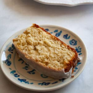 A slice of gluten free grapefruit bread on a plate.