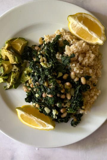 Healthy vegan meal with greens, lentils, and lemon for added flavor.