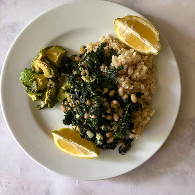 Healthy vegan meal with greens, lentils, and lemon for added flavor.