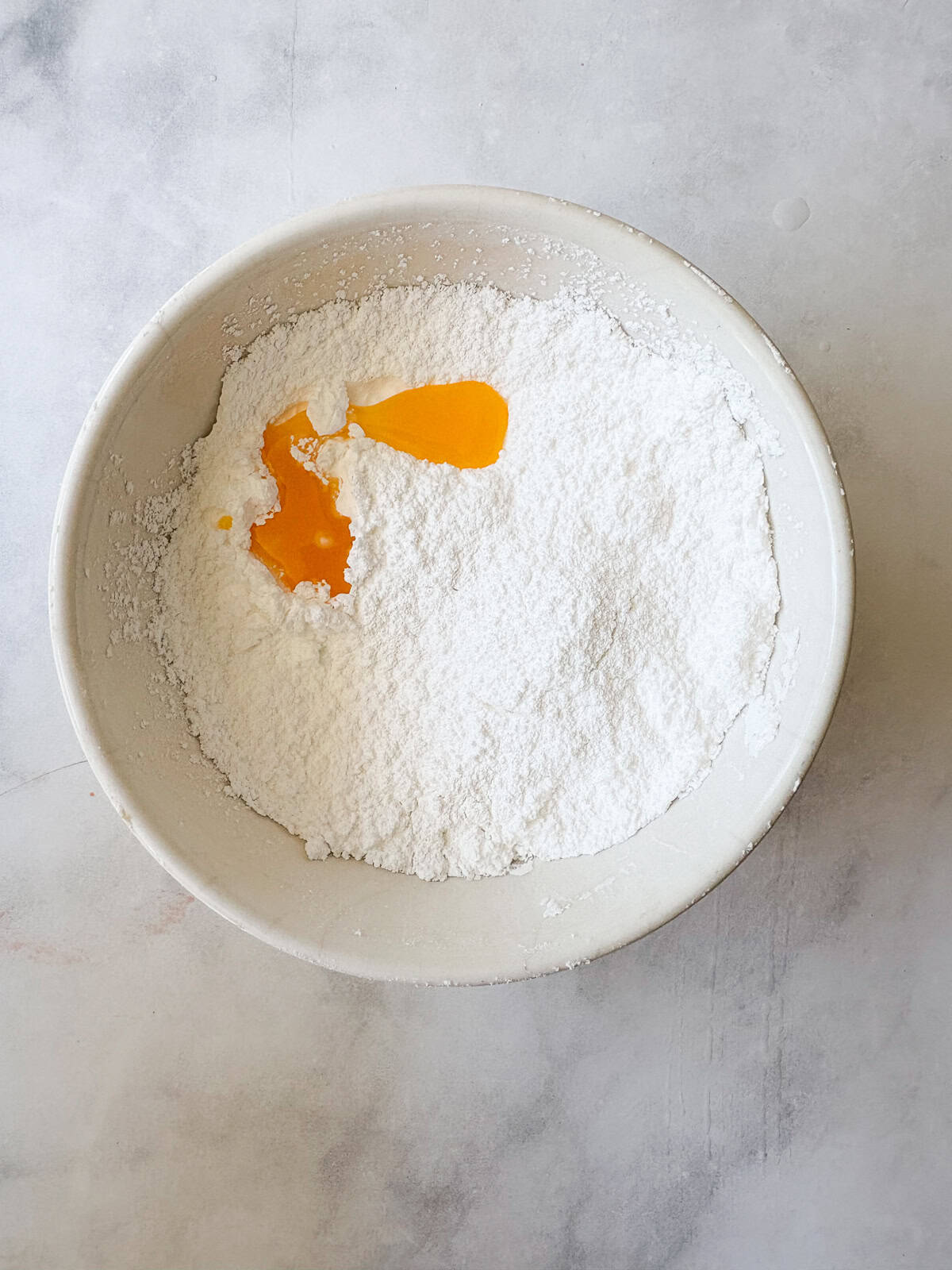 This two-ingredient orange glaze adds sweet citrus flavor to cakes, quick breads, scones, muffins, and more! Orange juice is added to powdered sugar to make a glaze.