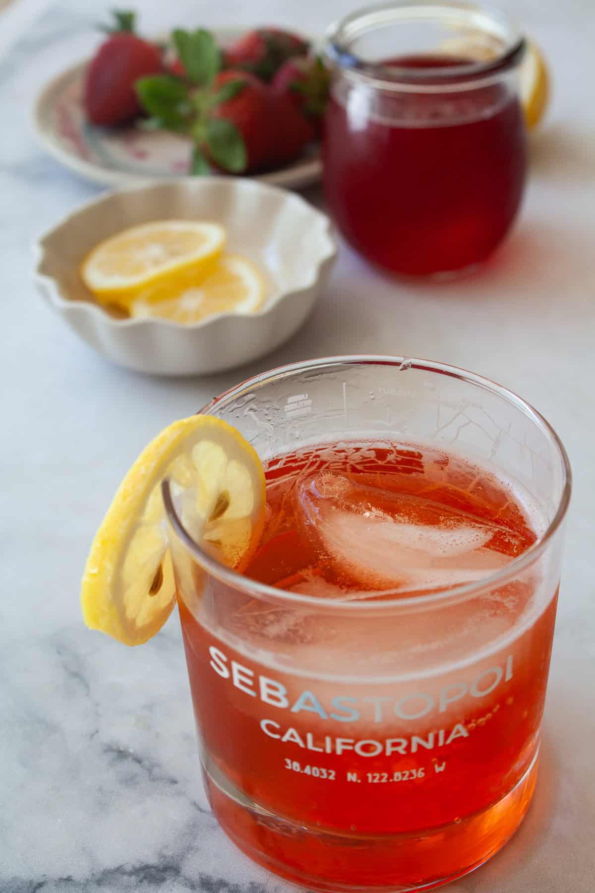 Enjoy this strawberry gin and tonic all summer long! A fruit twist on a classic, sweet strawberry syrup elevates this familiar cocktail.
