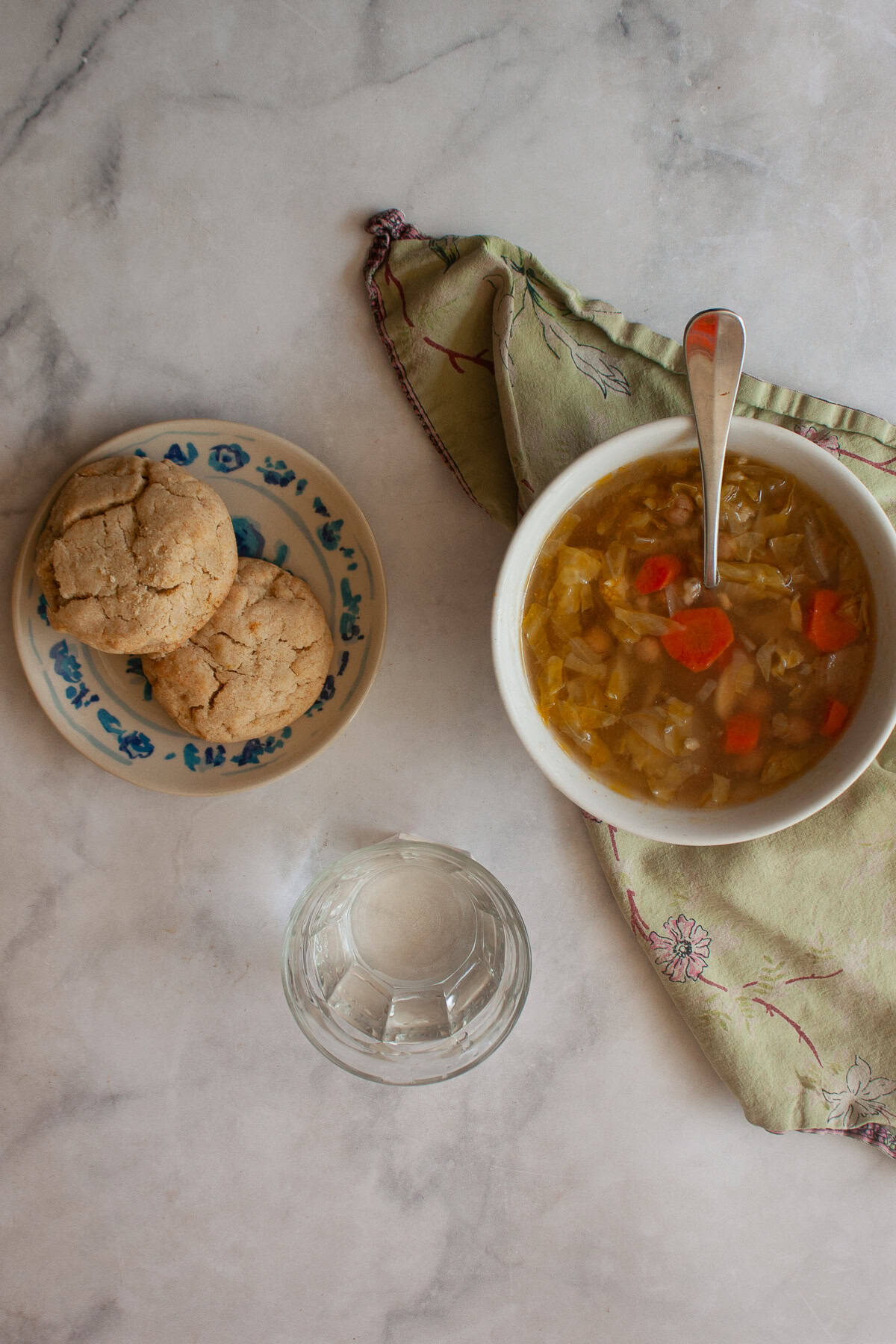 Tender and just lightly sweet gluten free cream biscuits are made in just one bowl with a handful of simple ingredients! Gluten free cream biscuits on a plate next to a bowl of soup.