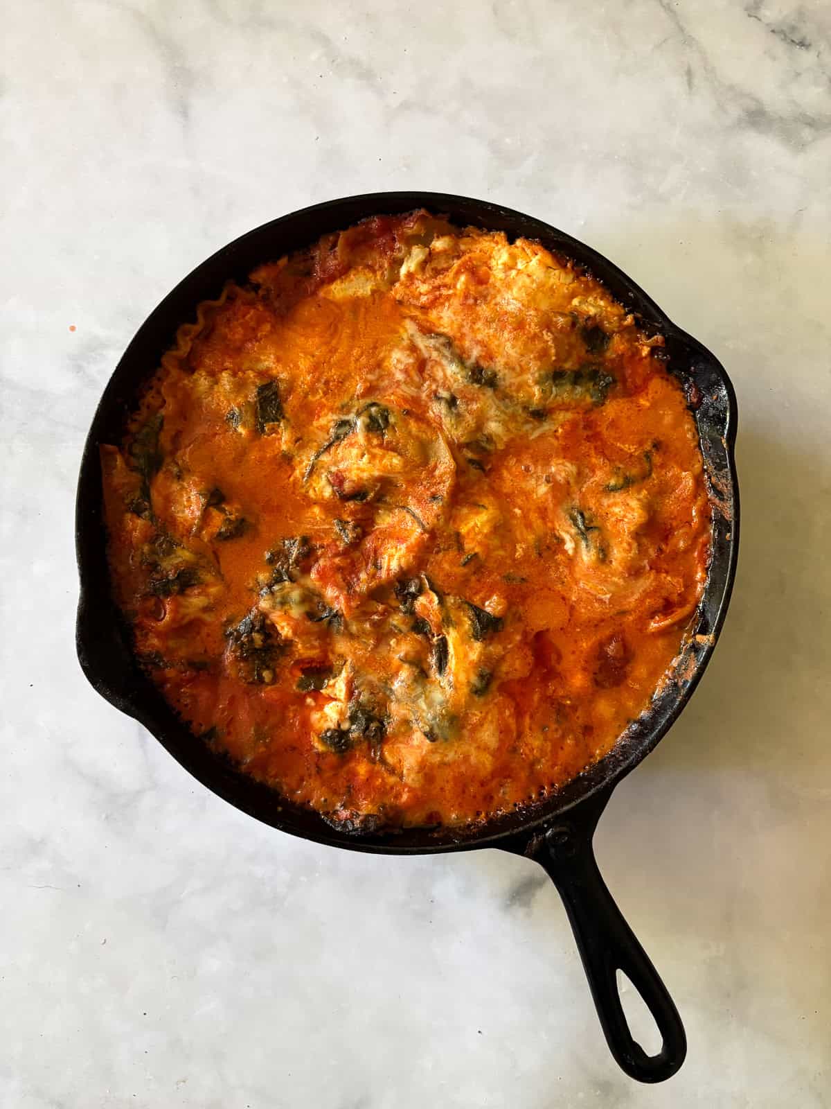 A baked pan of gluten free skillet lasagna.