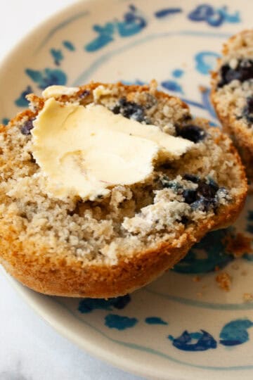 Butter on a whole wheat blueberry muffin.