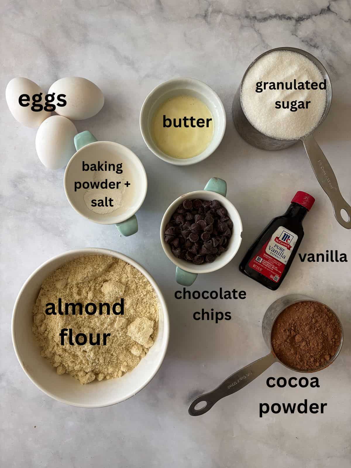 Deeply rich and chocolatey almond flour brownies are both grain-free and gluten-free. So much better than a boxed mix! Ingredients for almond flour brownies are text-labeled.