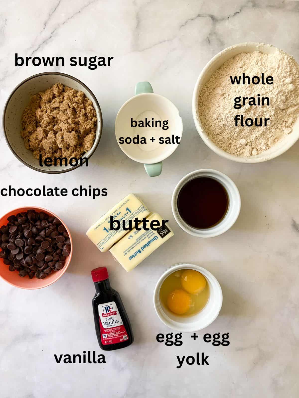 One of my favorite types of cookies, these maple chocolate chip cookies are sweetened with a combination of maple syrup and brown sugar. Ingredients for maple syrup chocolate chip cookies are text-labeled.