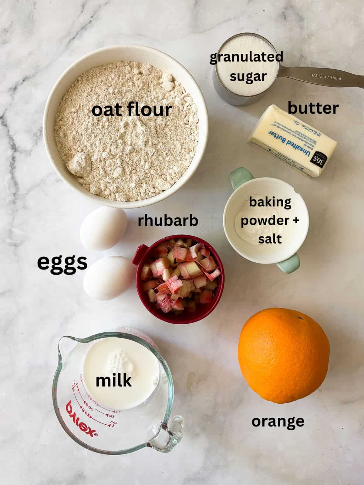 Whole-grain oat flour rhubarb scones are naturally gluten-free, warmed with a bit of orange zest and studded with jammy pockets of rhubarb. Oat flour rhubarb scones ingredients are text-labeled.