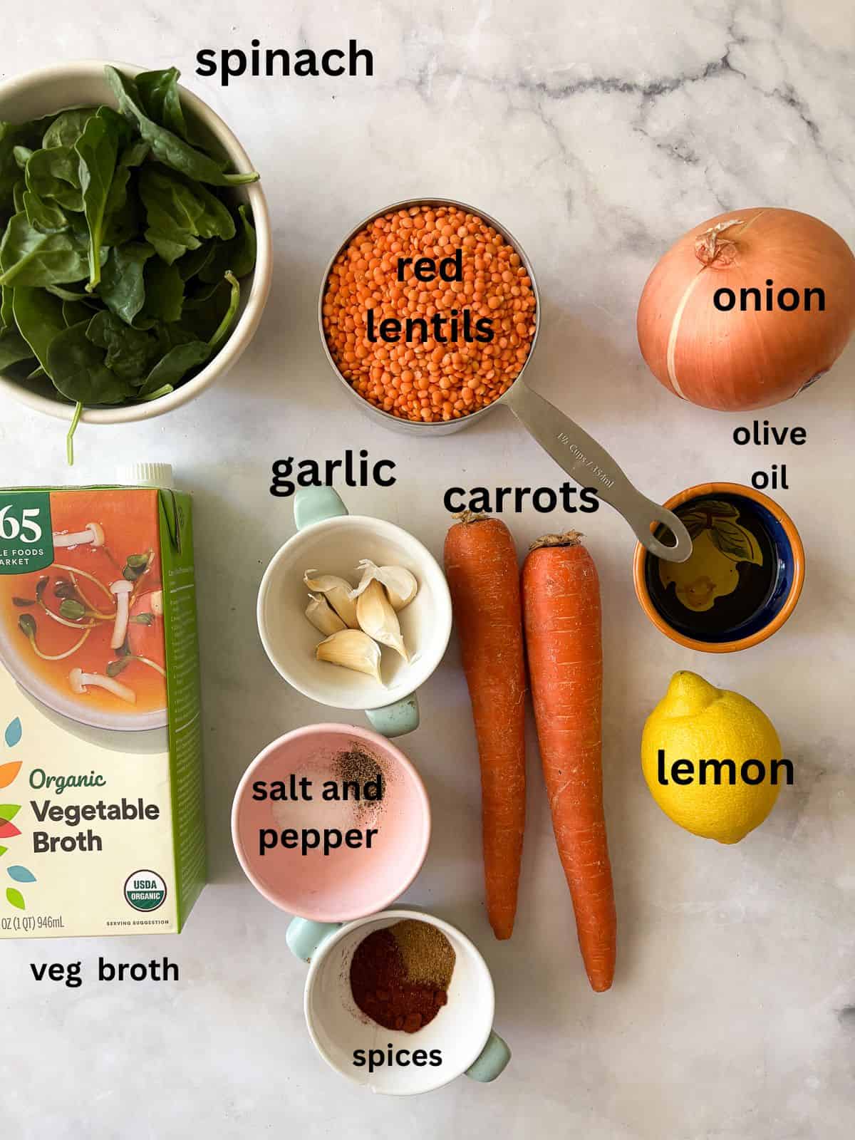 A hearty vegetarian red lentil stew that's packed with vegetables to make a satisfying dinner. Easy to adapt and make-ahead friendly. Ingredients for red lentil stew are text-labeled.