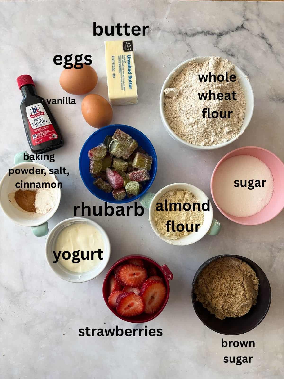 A tender strawberry rhubarb cake made with whole wheat flour, fresh fruit, and a buttery crumb. Rustic, easy, and perfect for summer baking. ingredients for strawberry rhubarb cake are text labeled