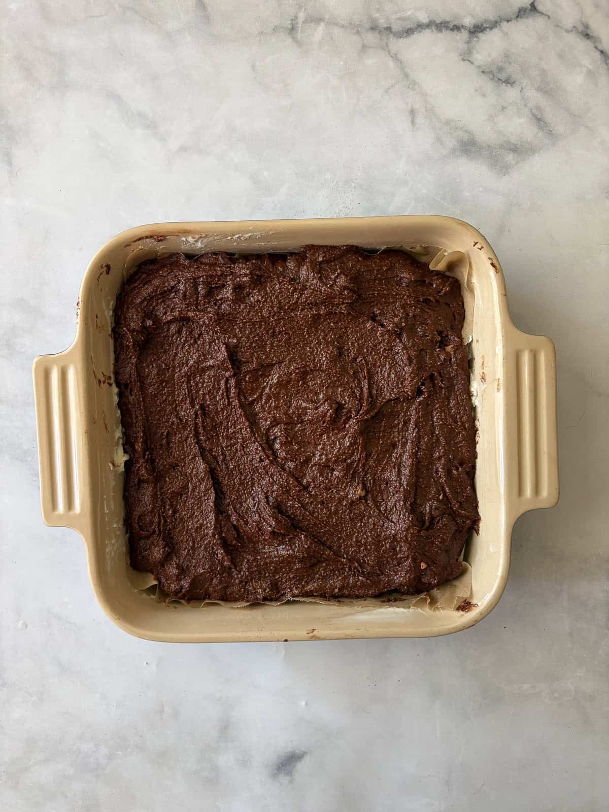 Deeply rich and chocolatey almond flour brownies are both grain-free and gluten-free. So much better than a boxed mix! Almond flour brownies batter in a square pan.
